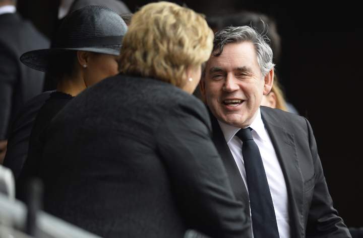 Forme Prime Minister Gordon Brown arrives for the memorial service of South African former president Nelson Mandela at the FNB Stadium (Soccer City) in Johannesburg on December 10, 2013. (Photo credit: Getty Images)