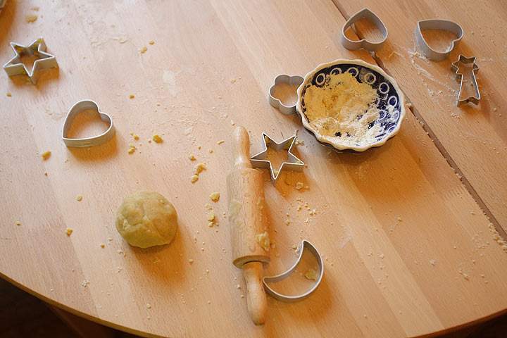 Baking dishes and ingredients for sugar cookies are pictured.