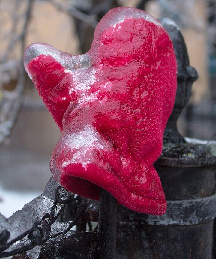 A mitten is seen frozen to the fence in Richmond Hill on December 22, 2013, a perfect example of ice accretion.