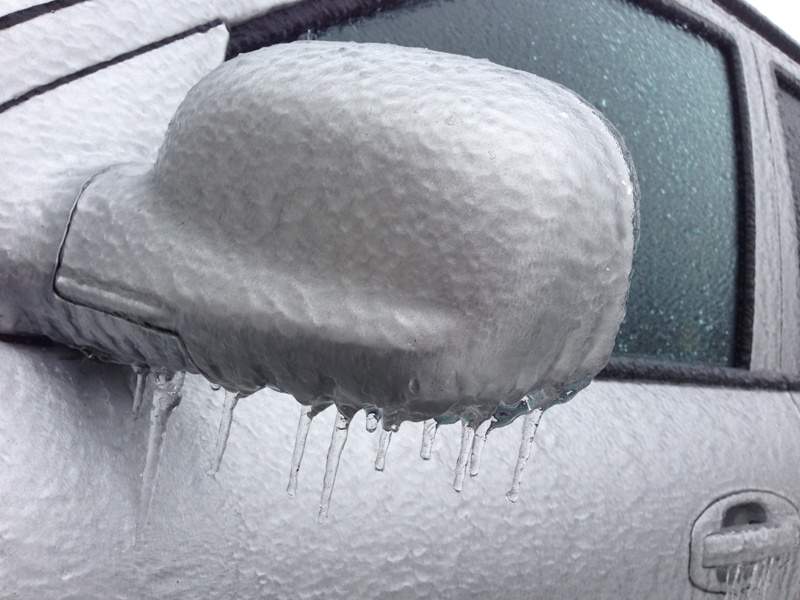 A thick layer of ice completely coats a car in Whitby.