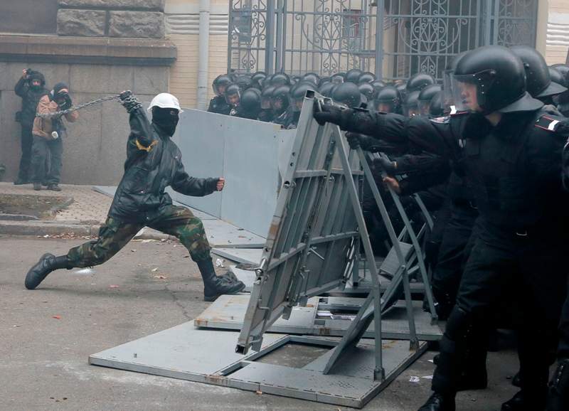 Protesters clash with police outside the presidential office in Kiev, Ukraine, on Sunday, Dec. 1, 2013.