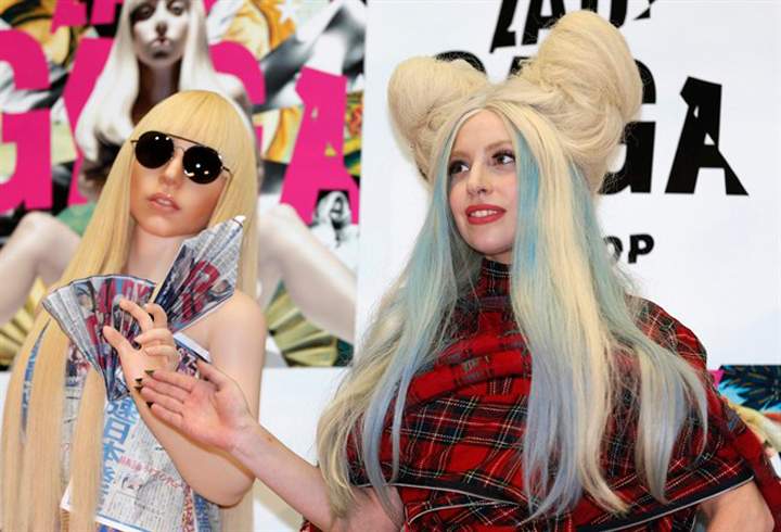Lady Gaga poses for photographers with her life-sized doll during a press conference to promote ARTPOP in Tokyo on Sunday.