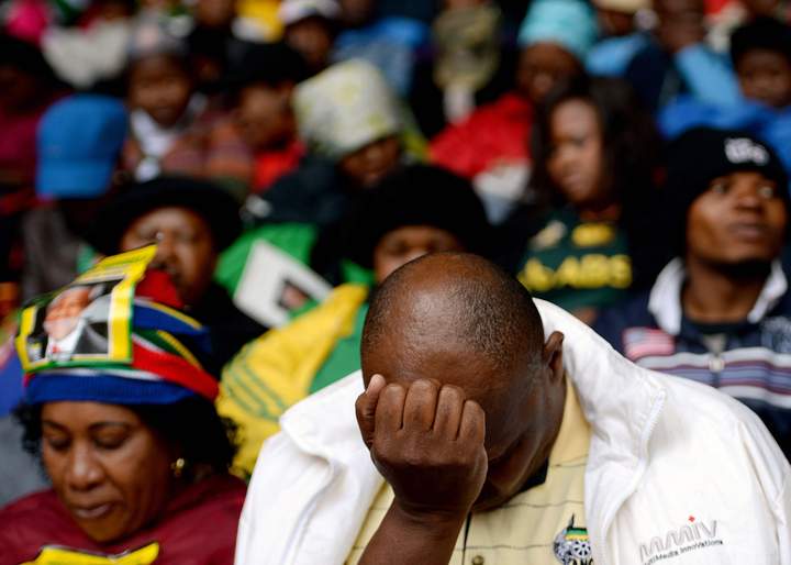Members of the public attend the Nelson Mandela memorial service at the FNB Stadium, on Dec. 10, 2013 in Johannesburg, South Africa. (Photo credit: Getty Images)