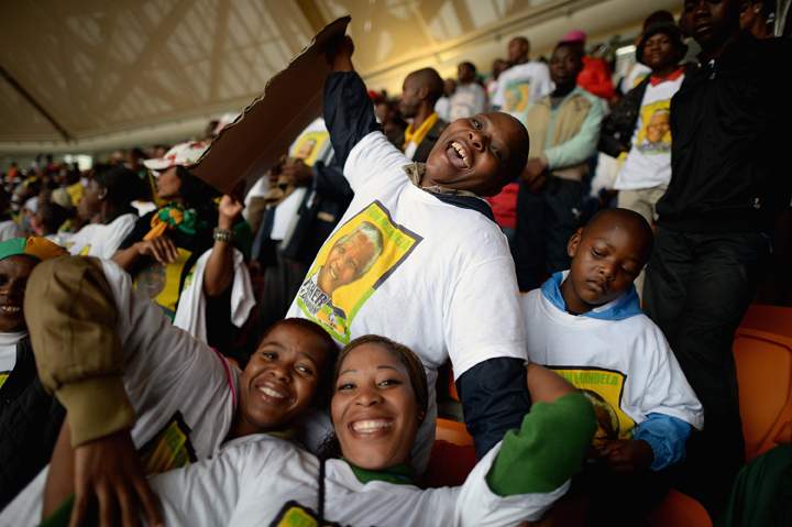 Members of the public attend the Nelson Mandela memorial service at the FNB Stadium, on December 10, 2013 in Johannesburg, South Africa. (Photo credit: Getty Images)