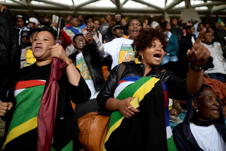 Members of the public attend the Nelson Mandela memorial service at the FNB Stadium, on Dec. 10, 2013 in Johannesburg, South Africa. (Photo credit: Getty Images)