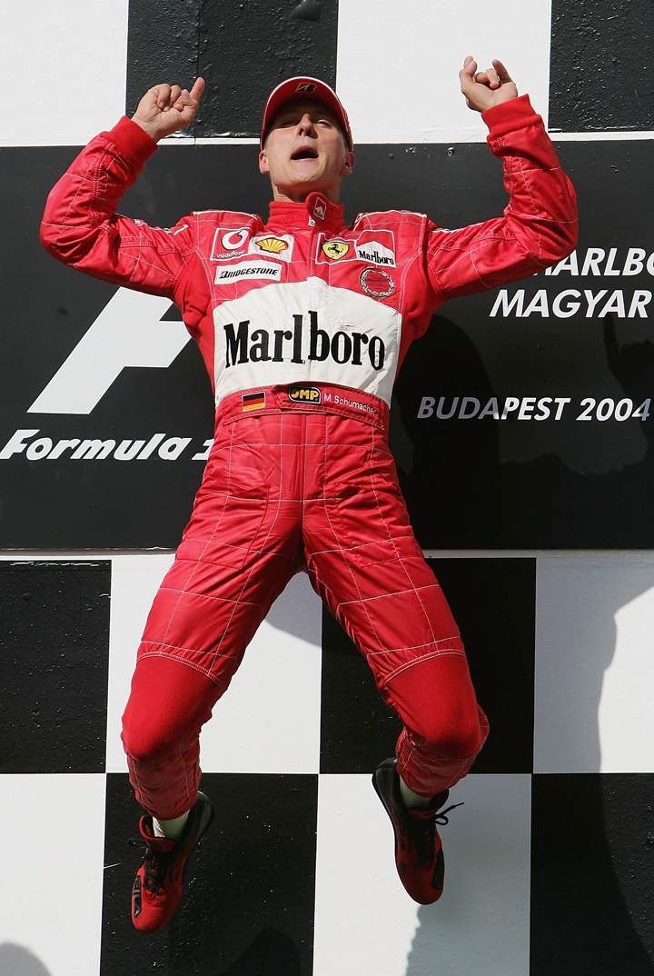 Michael Schumacher of Germany and Ferrari celebrates winning the Hungarian F1 Grand Prix at the Hungaroring Circuit on August 15, 2004, in Budapest, Hungary. (Photo credit: Getty Images).
