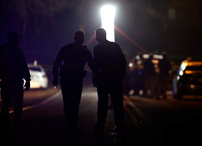 Police investigate a shooting near Wingate University on Wednesday, Dec. 4, 2013, in Wingate, N.C. 
