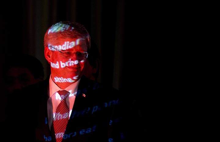 Prime Minister Stephen Harper walks past a projector following a Chinese New Year’s event in Burnaby, B.C.( The Canadian Press /Jonathan Hayward)