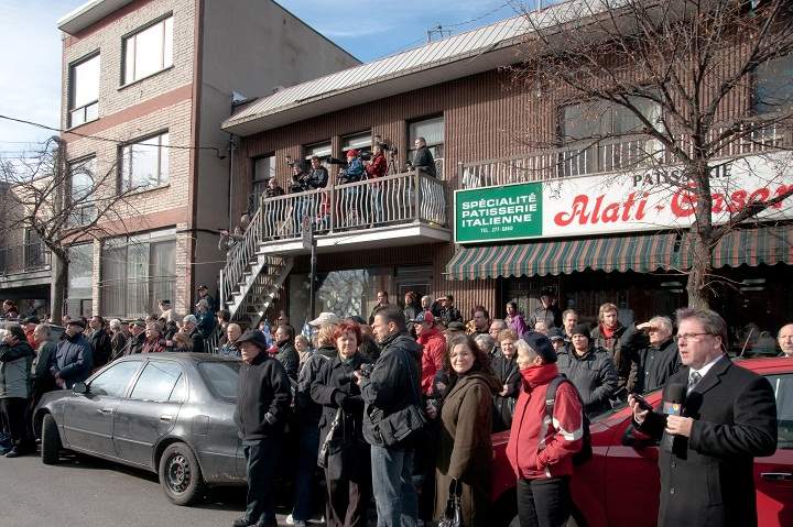 Hundreds of onlookers gathered in front of Notre-Dame de la Defense church to watch the funeral of slain crime boss Nicolo Rizzuto Sr.