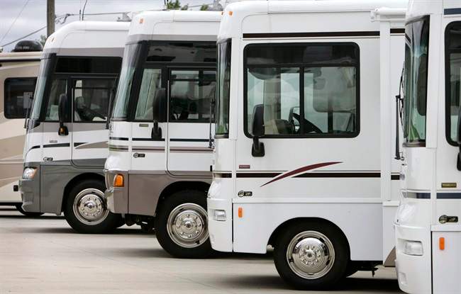 Recreational vehicles parked in lot.