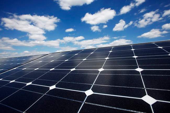FILE - In this Friday, April 29, 2011, file photo, solar panels line the roof of Ikea's Brooklyn store, in New York.