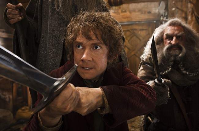 This image released by Warner Bros. Pictures shows Martin Freeman, left, and John Callen in a scene from 'The Hobbit: The Desolation of Smaug.'.