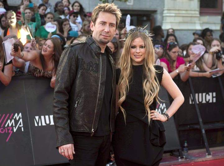 Chad Kroeger and Avril Lavigne pose on the red carpet during the 2013 Much Music Video Awards in Toronto. (CP Photo/Nathan Denette)