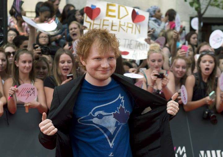 Ed Sheeran poses on the red carpet during the 2013 Much Music Video Awards in. (CP Photo/Chris Young)
