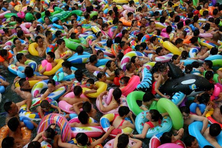 Residents try to cool off at a water park in Suining, southwest China’s Sichuan province, as a heat wave hit several provinces in China earlier this year. (Stringer/AFP/Getty Images)