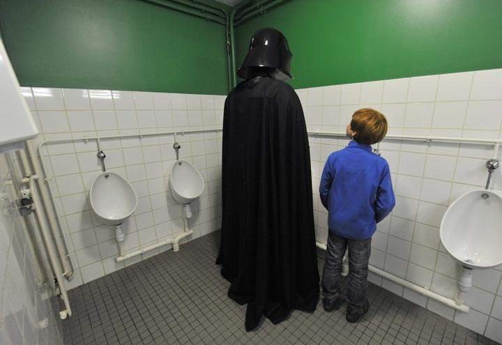 A fan dressed as Darth Vader is seen in a washroom at a Star Wars convention in France. (Thierry Zoccolan/AFP/Getty Images)