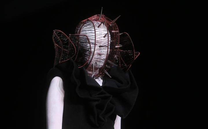 A model parades a creation from the Sheguang Hu Haute Couture collection during China Fashion Week in Beijing. (Stringer/AFP/Getty Images)