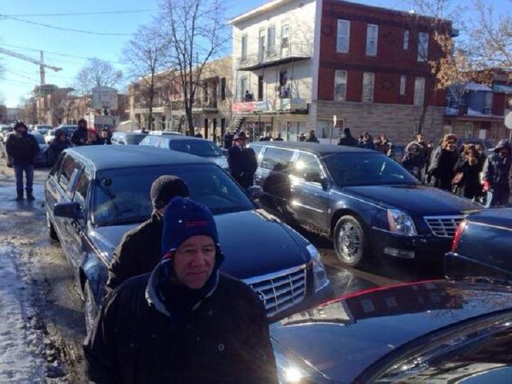 Cars line up in the streets outside the church in Little Italy where the funeral was held for reputed Mafia boss Vito Rizzuto on December 30, 2013.