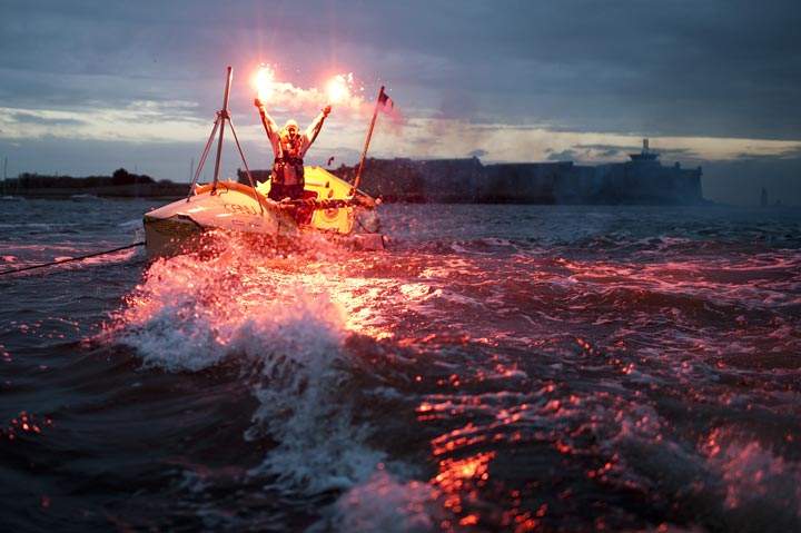 Canadian sailor Mylene Paquette celebrates as she arrives at the Lorient Harbour, western France, on November 12, 2013. Mylene Paquette, a 35-year-old from Quebec, is the first North American to have crossed the Atlantic Ocean, a 2,700 nautical mile (4,300-km) long journey, on a rowboat in 129 days. (Jean-Sebastien Evrard/AFP/Getty Images)