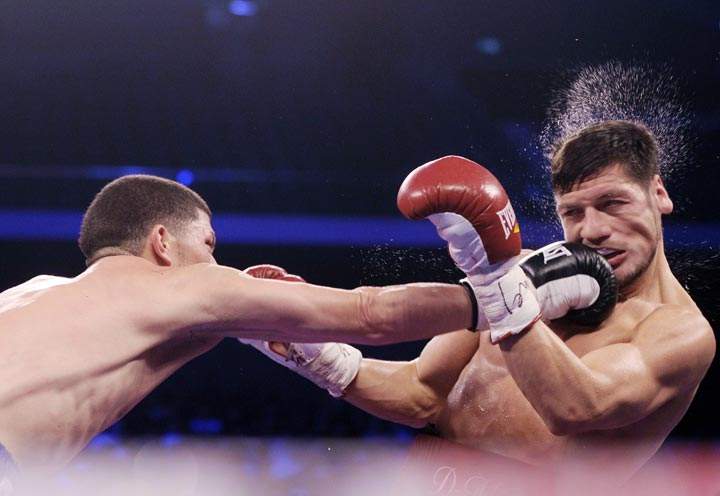 Roman Martinez (L) punches Diego Magdaleno during the WBO world super featherweight title bout at the ‘Fists of Gold’ boxing event in Macau on April 6, 2013. (Dale de la Rey/AFP/Getty Images)