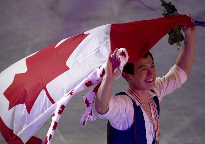 Patrick Chan does a victory lap after winning the men’s competition at the ISU World Figure Skating Championships in London, Ontario on Friday March 15, 2013. (Frank Gunn / The Canadian Press)