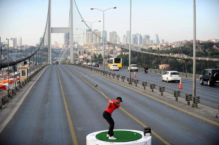 Tiger Woods hits a golf ball during an event to promote Turkish Airlines Open golf tournament in Istanbul on November 5, 2013. (Bulent Kilic/AFP/Getty Images)