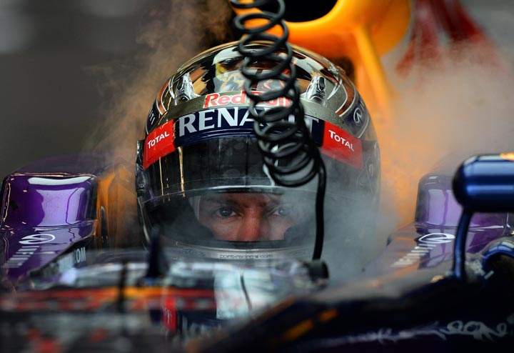 Sebastian Vettel cools off at a pit stop during a practice session for the United States Formula One Grand Prix at Circuit of The Americas on November 16, 2013 in Austin, Texas. (Jewel Samad/AFP/Getty Images)