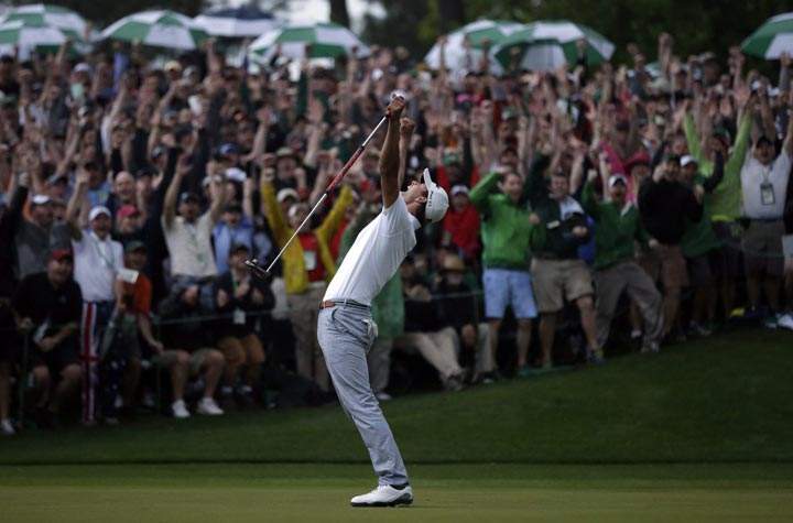 Adam Scott celebrates after making a birdie putt on the second playoff hole to win the Masters golf tournament on Sunday, April 14, 2013, in Augusta, Ga. (AP Photo/David J. Phillip)