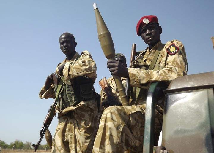 This picture taken on December 25, 2013 shows South Sudanese troops loyal to President Salva Kiir pictured at Bor airport after they re-captured it from rebel forces. 