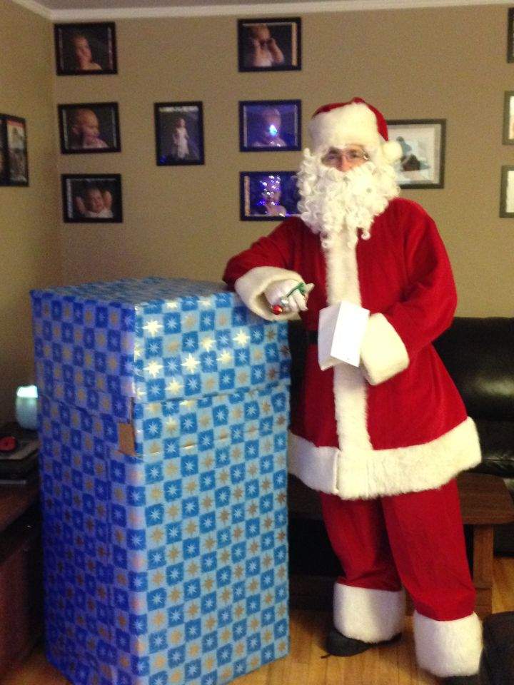 Santa delivers a five-year-old girl her father for Christmas.