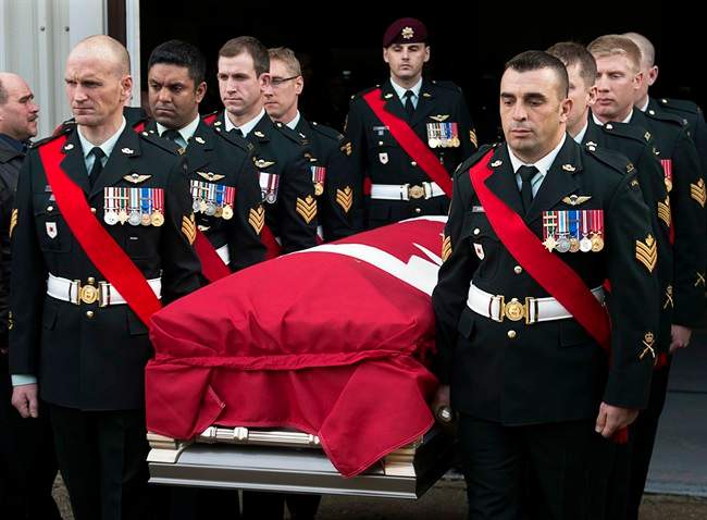 Members of The Royal Canadian Regiment carry the casket at the funeral for Warrant Office Michael Robert McNeil at the Truro Armouries in Truro, N.S. on Thursday, Dec. 5, 2013. McNeil completed several tours of duty including Afghanistan, Bosnia and Croatia. McNeil took his own life late last month at CFB Petawawa. 