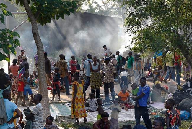 Internally displaced people gather in the Don Bosco Center outside Banghi, Central African Republic, Saturday Dec. 7, 2013, fearing reprisal attacks from the Muslim ex-rebels who control Central African Republic. 