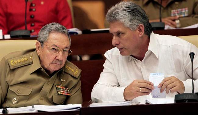 Incoming Cuban president Miguel Diaz-Canel, right, is seen in this 2013 file photo with Raul Castro.