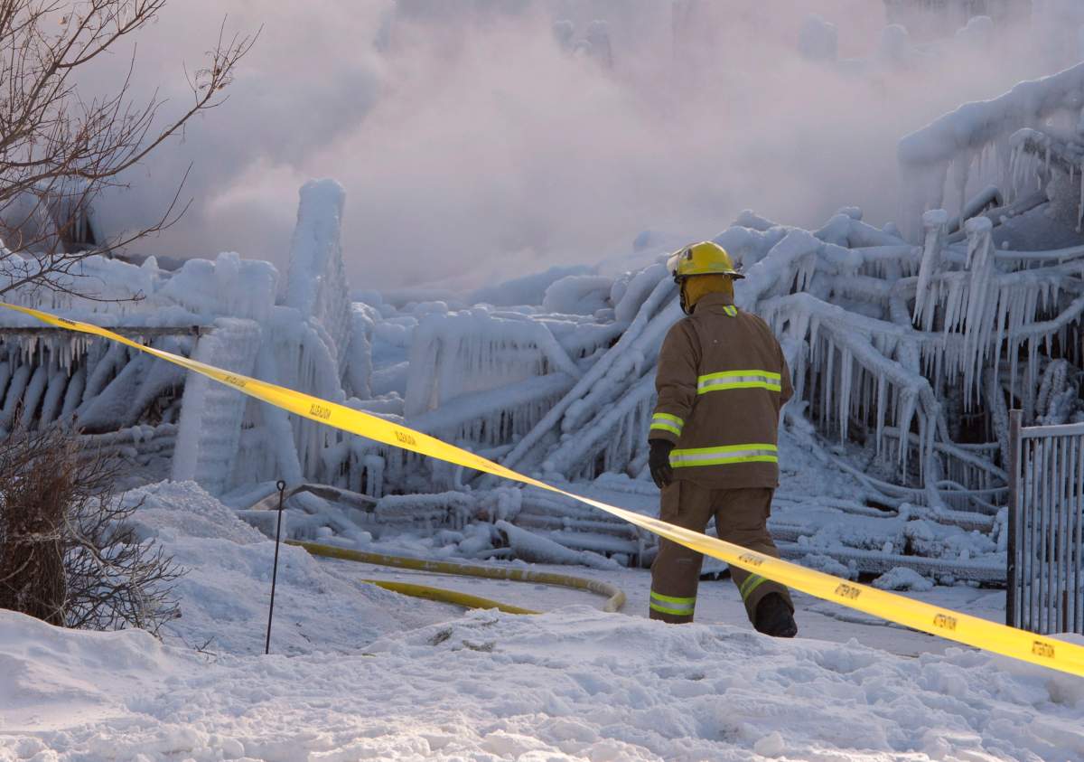 Firefighters work at the scene on Thursday.