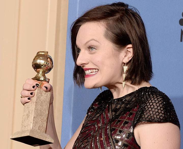 Elisabeth Moss celebrates at the Golden Globe Awards on Jan. 12, 2014.