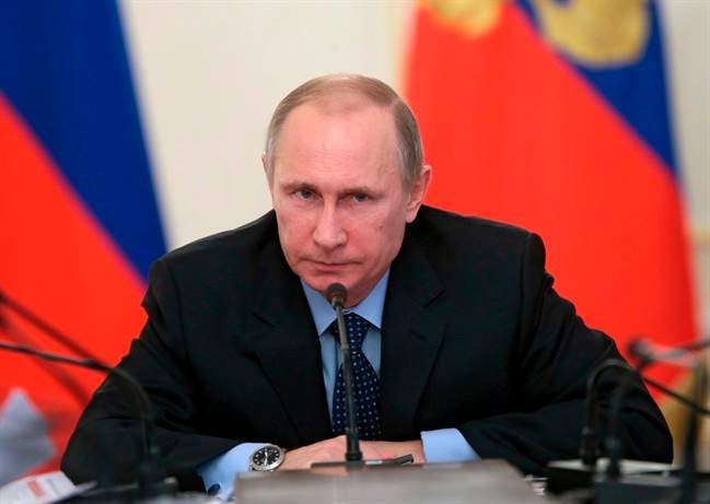 Russian President Vladimir Putin chairs a meeting with officials focusing on economy in the Novo-Ogaryovo residence outside Moscow, Russia, Thursday, Jan. 30, 2014. (AP Photo/RIA-Novosti, Mikhail Metzel, Presidential Press Service).