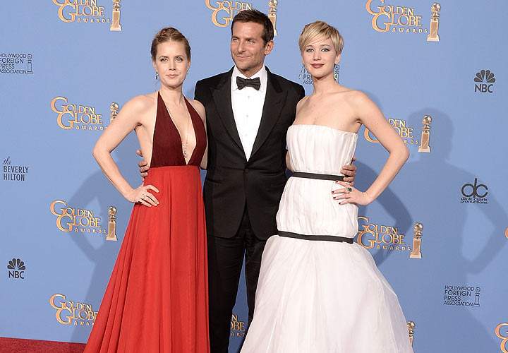 (L-R) Actors Amy Adams, Bradley Cooper and Jennifer Lawrence, winners of Best Motion Picture – Musical or Comedy for ‘American Hustle,’ pose in the press room during the 71st Annual Golden Globe Awards held at The Beverly Hilton Hotel on January 12, 2014 in Beverly Hills, California. (Photo by Kevin Winter/Getty Images)