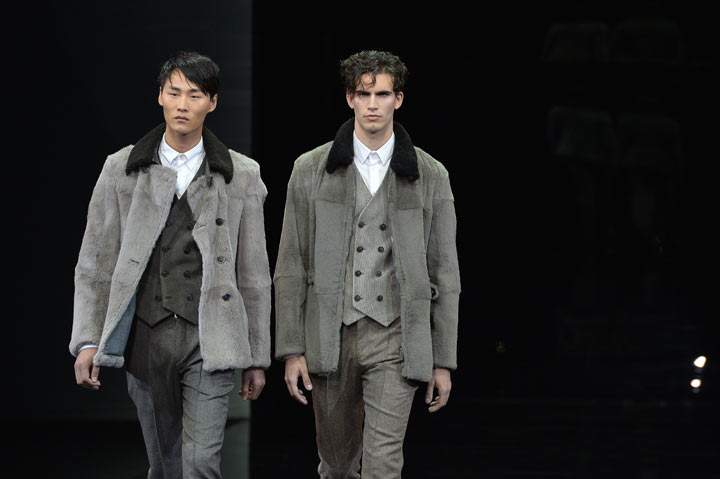 Models present creations for fashion house Giorgio Armani as part of Autumn/Winter 2014 Milan Collections during the Men’s fashion week on January 14, 2014 in Milan. (Photo by ANDREAS SOLARO/AFP/Getty Images)