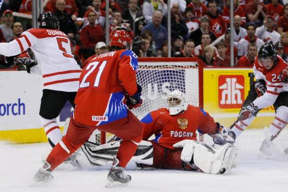 Vadim Zhelobnyuk #1 of Team Russia blocks the puck on an attempt by PK Subban #5 of Team Canada as Jamie Benn #24 crashes the net during the semifinals at the IIHF World Junior Championships at the Ottawa Civic Centre on January 03, 2009 in Ottawa.