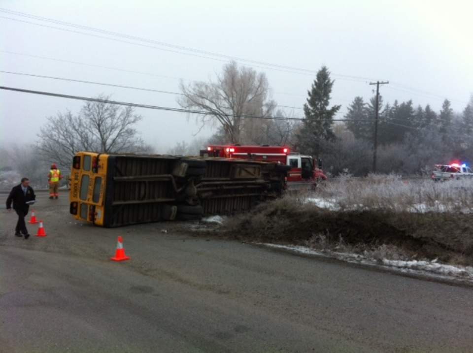 A school bus overturned after hitting a bank on Reimer Road in Vernon Thursday morning.
