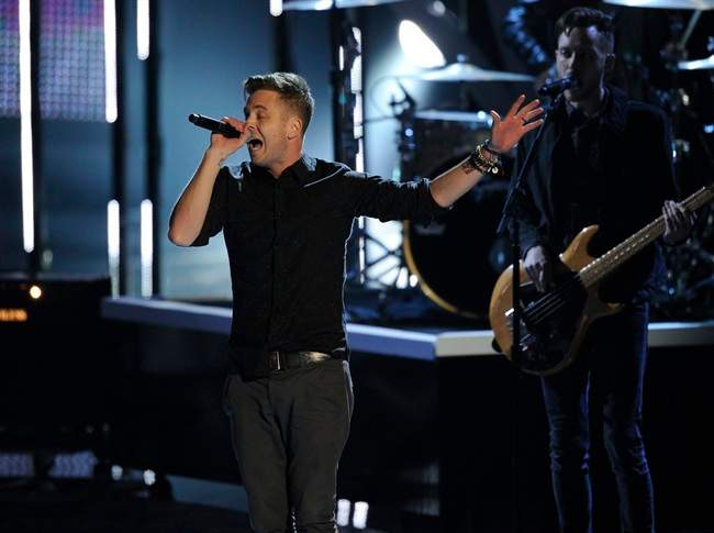 Ryan Tedder, of the musical group OneRepublic, performs "Counting Stars" on stage at the 40th annual People's Choice Awards at the Nokia Theatre L.A. Live on Wednesday, Jan. 8, 2014, in Los Angeles. (Photo by Chris Pizzello/Invision/AP).