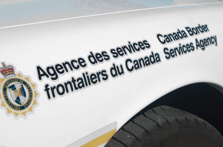 A Canada Border Services Agency (CBSA) logo on patrol car. 