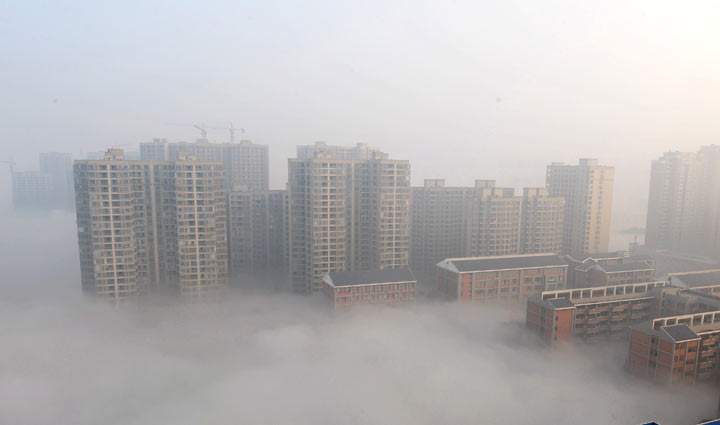 Buildings are shrouded in smog on January 14, 2014 in Changsha, Hunan Province of China. 