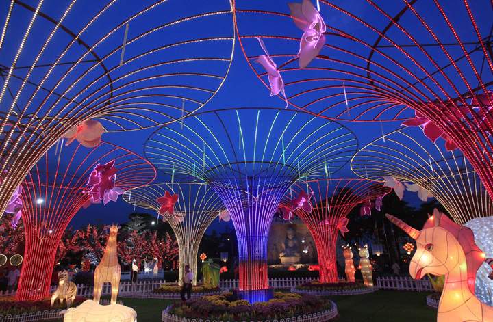 A man walks at Fo Guang Shan Dong Zen Buddhist Temple decorated for the Chinese New Year in Jenjarom, outside Kuala Lumpur, Malaysia, Wednesday, Jan. 29, 2014. (Photo credit: Lai Seng Sin/AP Photo)