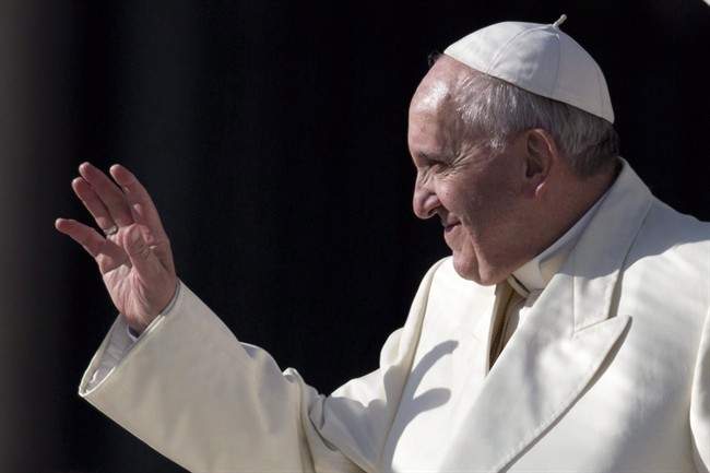 Pope Francis waves as he leaves at the end of his weekly general audience, in St. Peter's Square, at the Vatican, Wednesday, Jan. 15, 2014. 