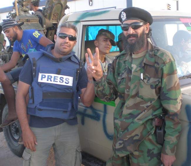 Mohamed Fahmy (left), the Egyptian-Canadian journalist being detained in Cairo, is shown in a handout photo.