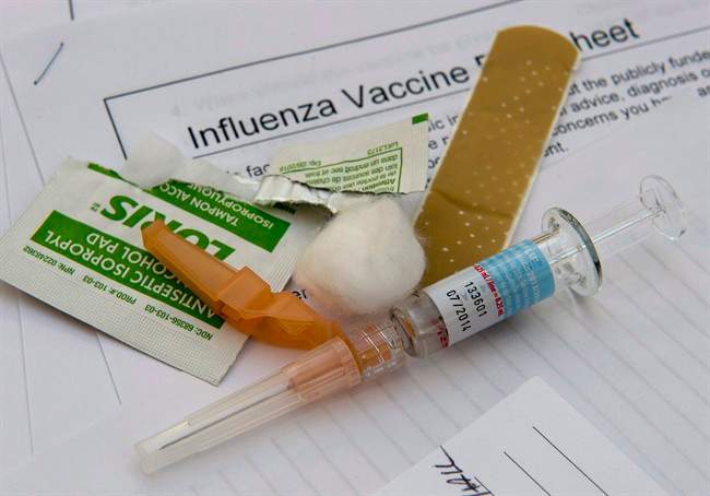 A syringe with the flu vaccine sits ready for use at the annual meeting of the Ontario Hospital Association in Toronto.