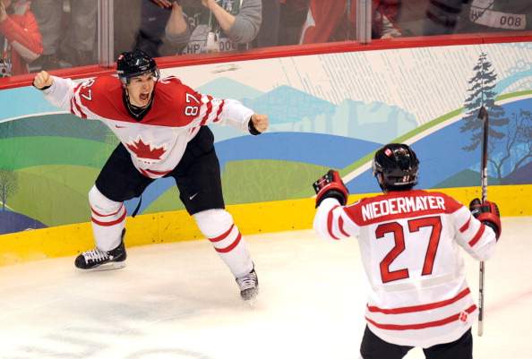 Canadian forward Sidney Crosby (87) and Canadian defence Scott Niedermayer (27)jubilates as their team wins gold against the USA in the Men's Gold Medal Hockey match at the Canada Hockey Place during the XXI Winter Olympic Games in Vancouver, Canada on February 28, 2010.