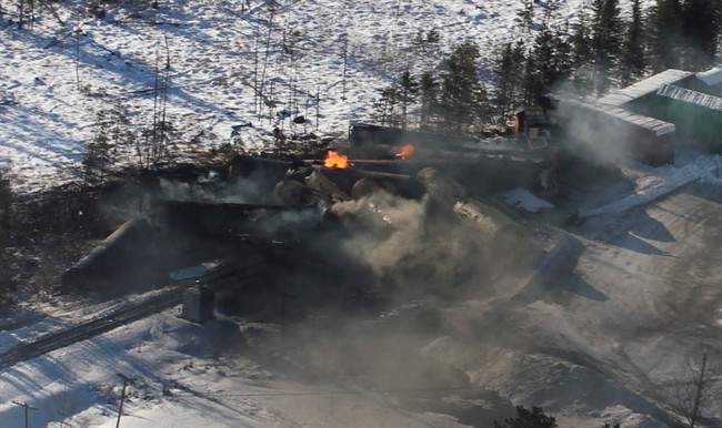 Derailed train cars continued to burn in Plaster Rock, N.B. on Jan. 8. THE CANADIAN PRESS/Tom Bateman