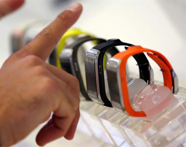 A visitor points at smartwatches in Berlin.